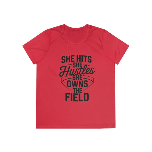 She Hits She Hustles She Owns the Field Ladies Moisture Wicking Tee