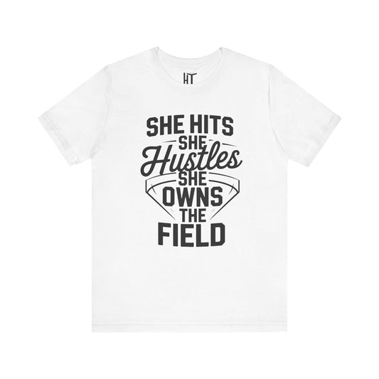She Hits She Hustles She Owns the Field  T-Shirt
